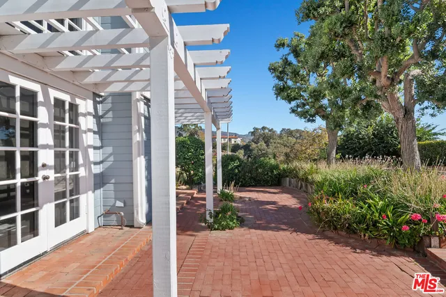 a bed room with a bed and a chair
