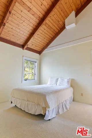 a open kitchen with stainless steel appliances granite countertop a sink dishwasher stove and cabinets with wooden floor