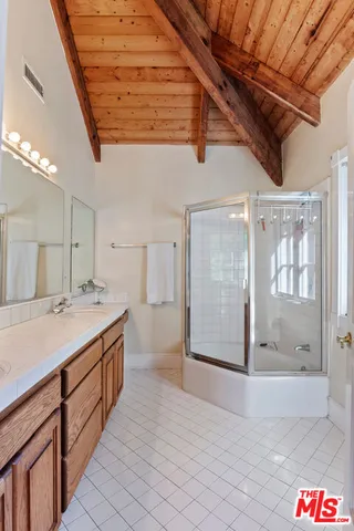 a outdoor living space with patio furniture and a ceiling fan