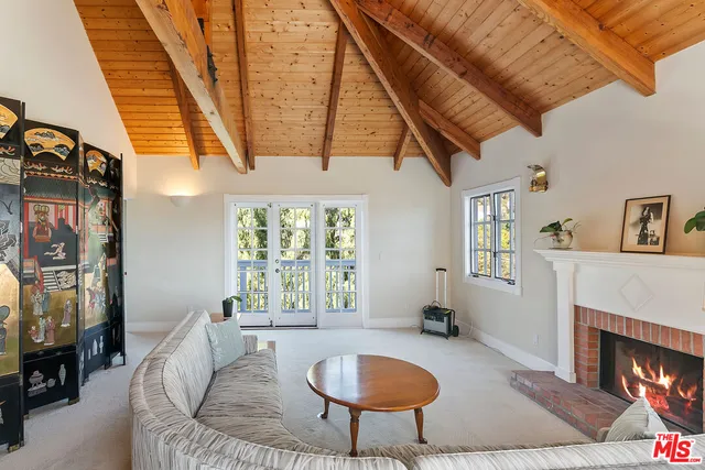 an aerial view of a houses with a yard