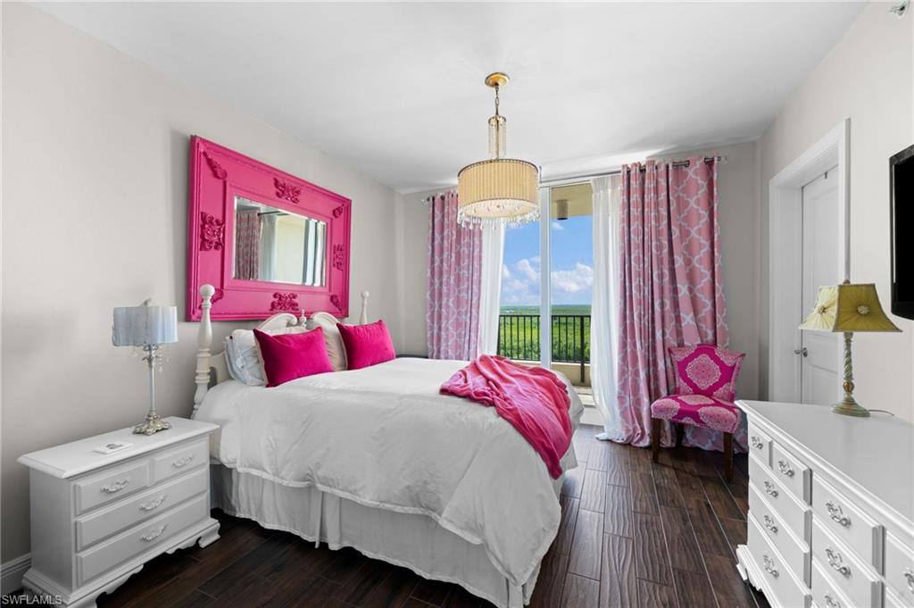 1050 Borghese Lane, Unit 902 Naples, FL 34114 - Photo 24 of 50 Bedroom with dark hardwood / wood-style floors