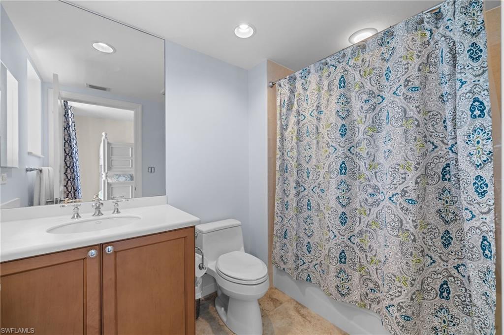 1050 Borghese Lane, Unit 902 Naples, FL 34114 - Photo 28 of 50 Full bathroom featuring vanity, toilet, and shower / tub combo