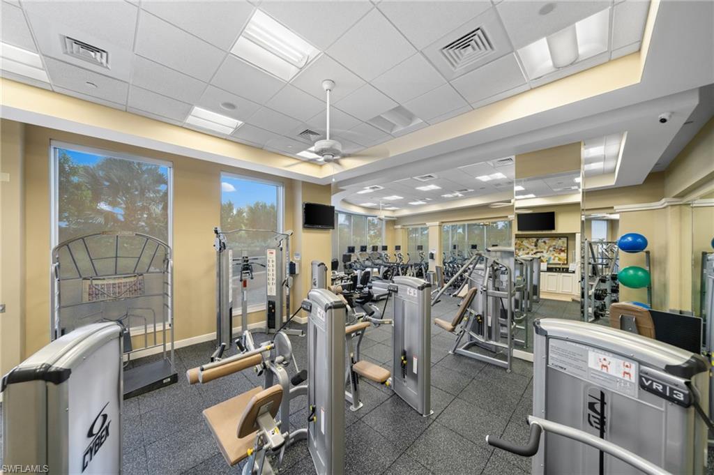 1050 Borghese Lane, Unit 902 Naples, FL 34114 - Photo 40 of 50 Exercise room with ceiling fan and a drop ceiling
