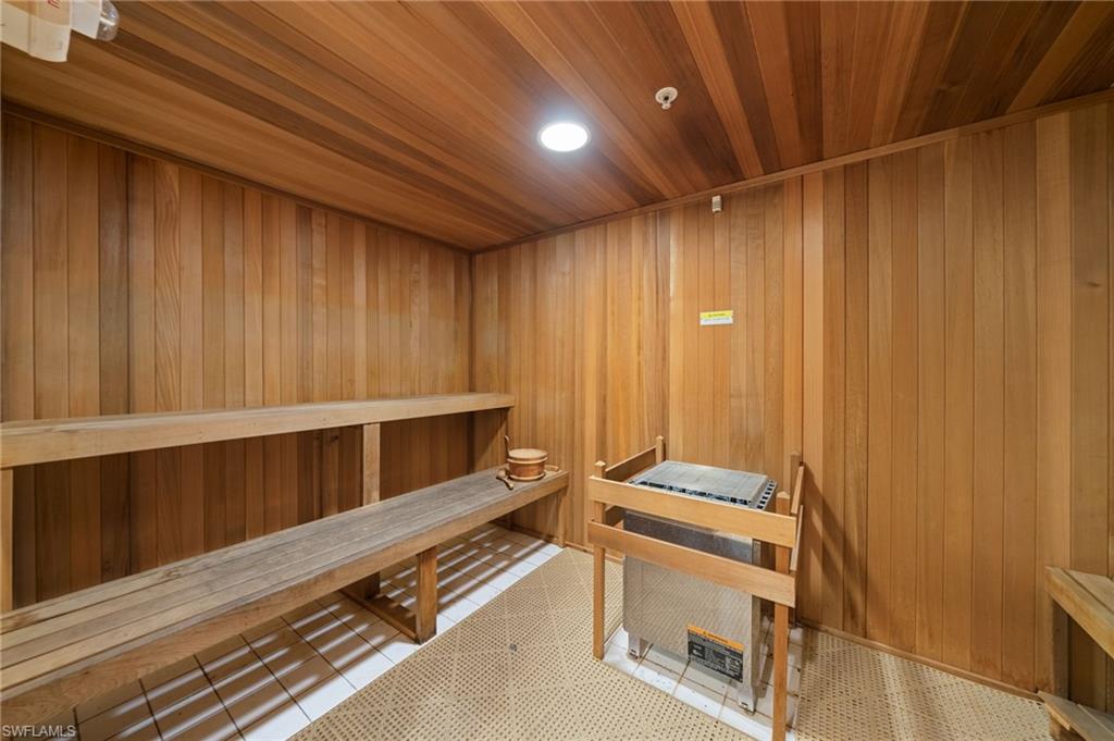 1050 Borghese Lane, Unit 902 Naples, FL 34114 - Photo 41 of 50 View of sauna with wood ceiling, wooden walls, and tile patterned floors