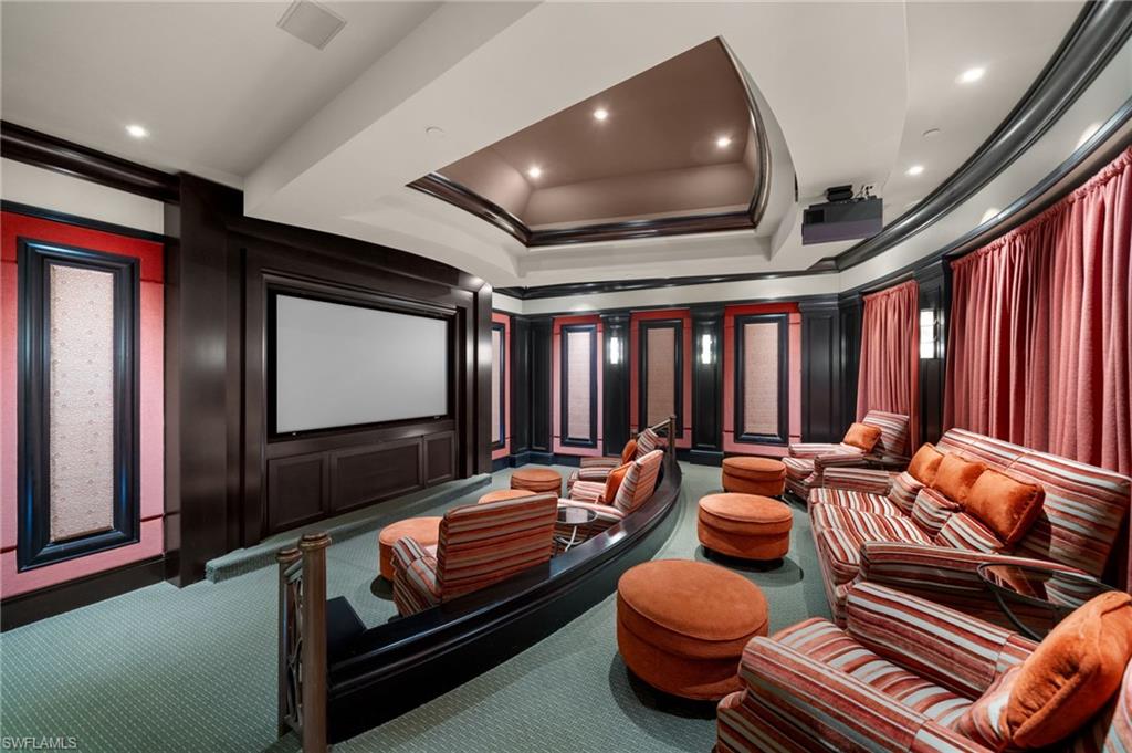 1050 Borghese Lane, Unit 902 Naples, FL 34114 - Photo 42 of 50 Carpeted cinema featuring crown molding and a raised ceiling