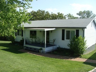 1126 Ross Road Vinton, VA 24179 - Photo 1 of 13 a front view of a house with a garden