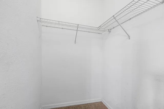 a view of a room with racks on the wall