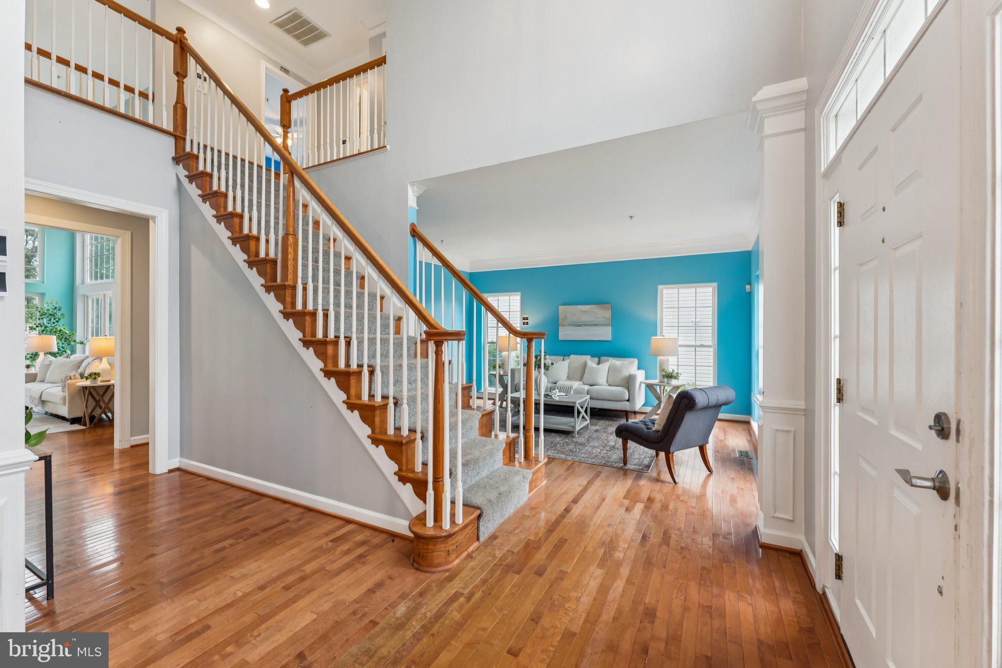14520 Fairdale Road Silver Spring, MD 20905 - Photo 11 of 50 a view of a hallway with wooden floor and windows