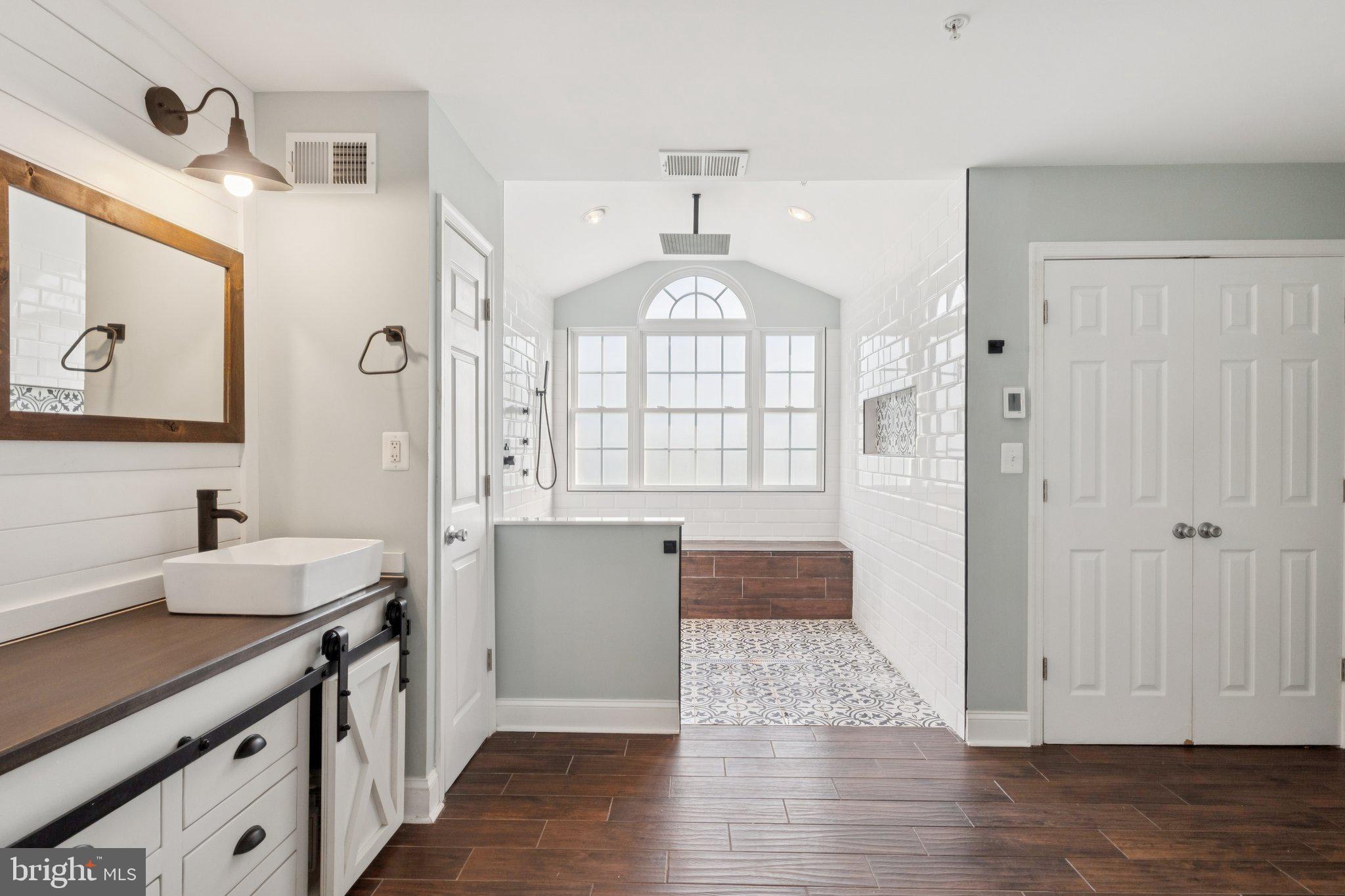 14520 Fairdale Road Silver Spring, MD 20905 - Photo 18 of 50 a view of a bathroom with mirror and bathtub