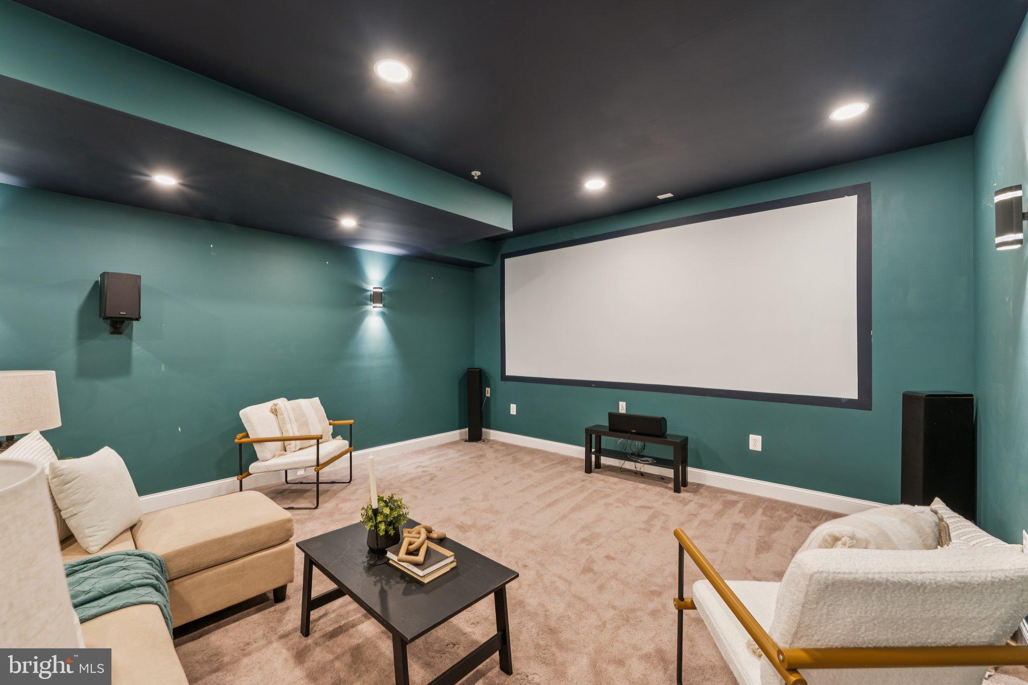 14520 Fairdale Road Silver Spring, MD 20905 - Photo 29 of 50 a living room with furniture and a projector screen