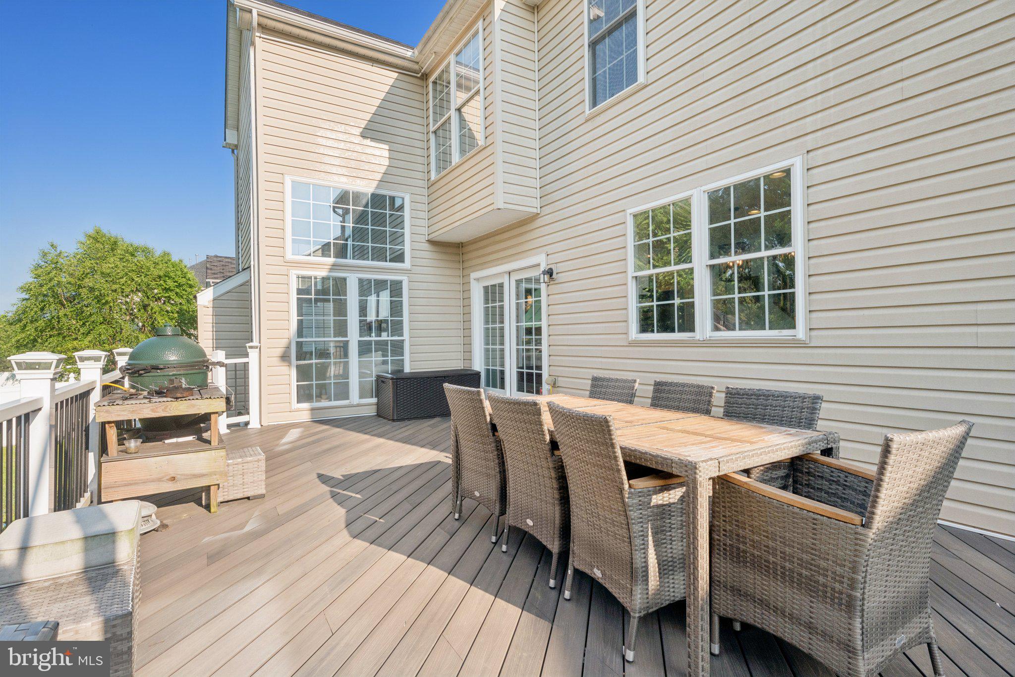 14520 Fairdale Road Silver Spring, MD 20905 - Photo 43 of 50 a view of a patio with table and chairs with wooden floor and fence