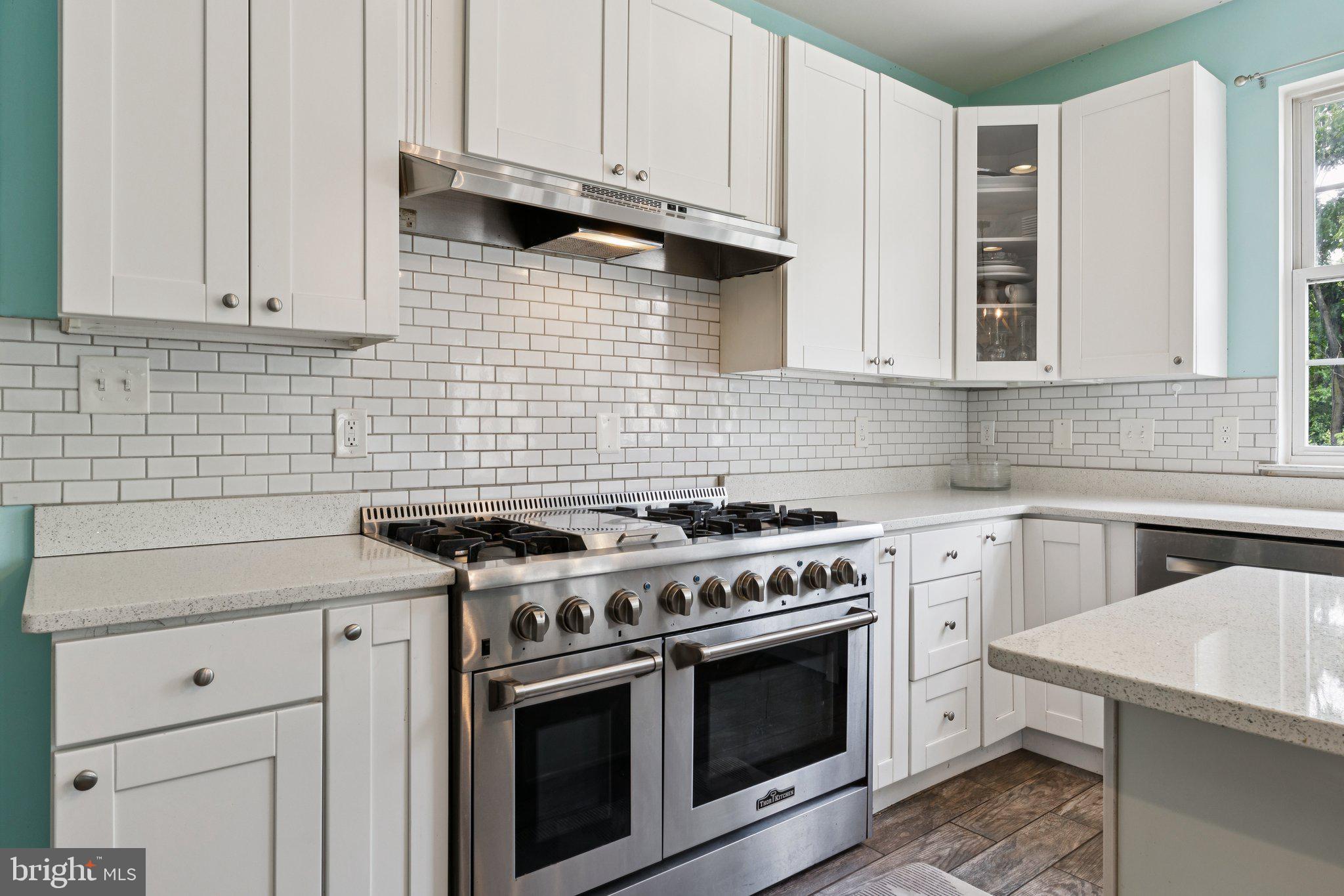 14520 Fairdale Road Silver Spring, MD 20905 - Photo 5 of 50 a kitchen with granite countertop white cabinets and stainless steel appliances