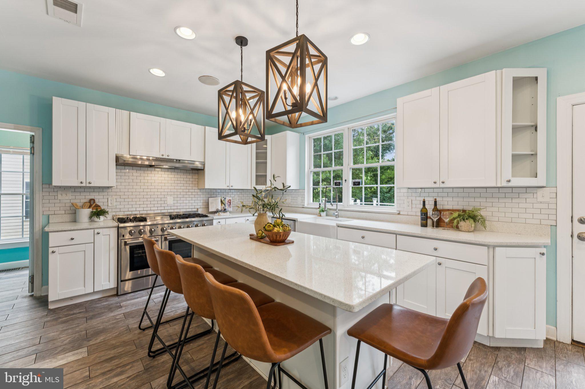 14520 Fairdale Road Silver Spring, MD 20905 - Photo 6 of 50 a kitchen with a dining table chairs stainless steel appliances and cabinets
