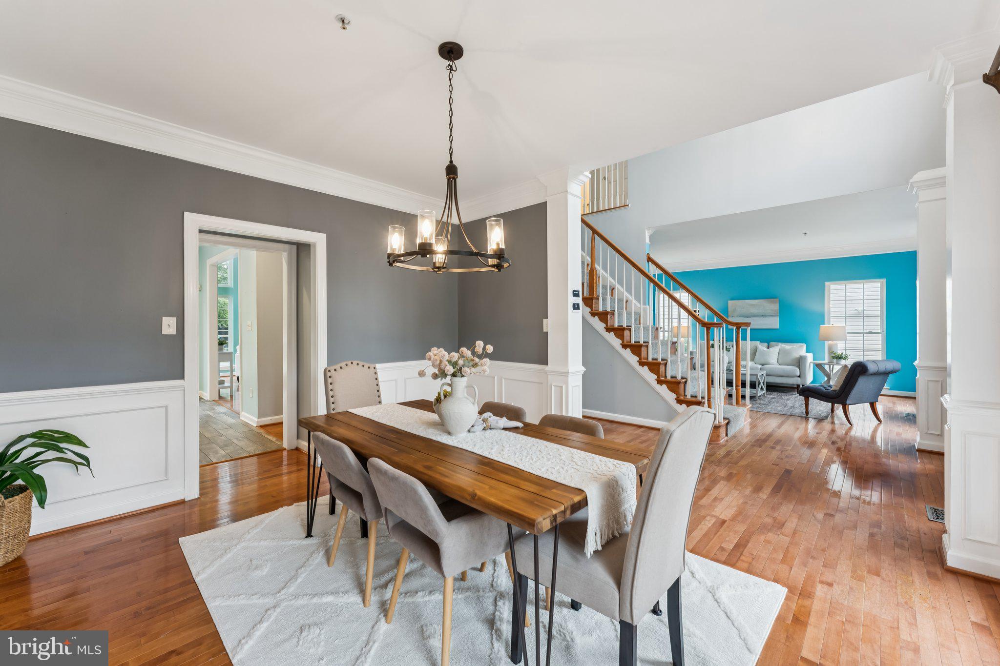 14520 Fairdale Road Silver Spring, MD 20905 - Photo 9 of 50 a dining room with furniture a chandelier and wooden floor