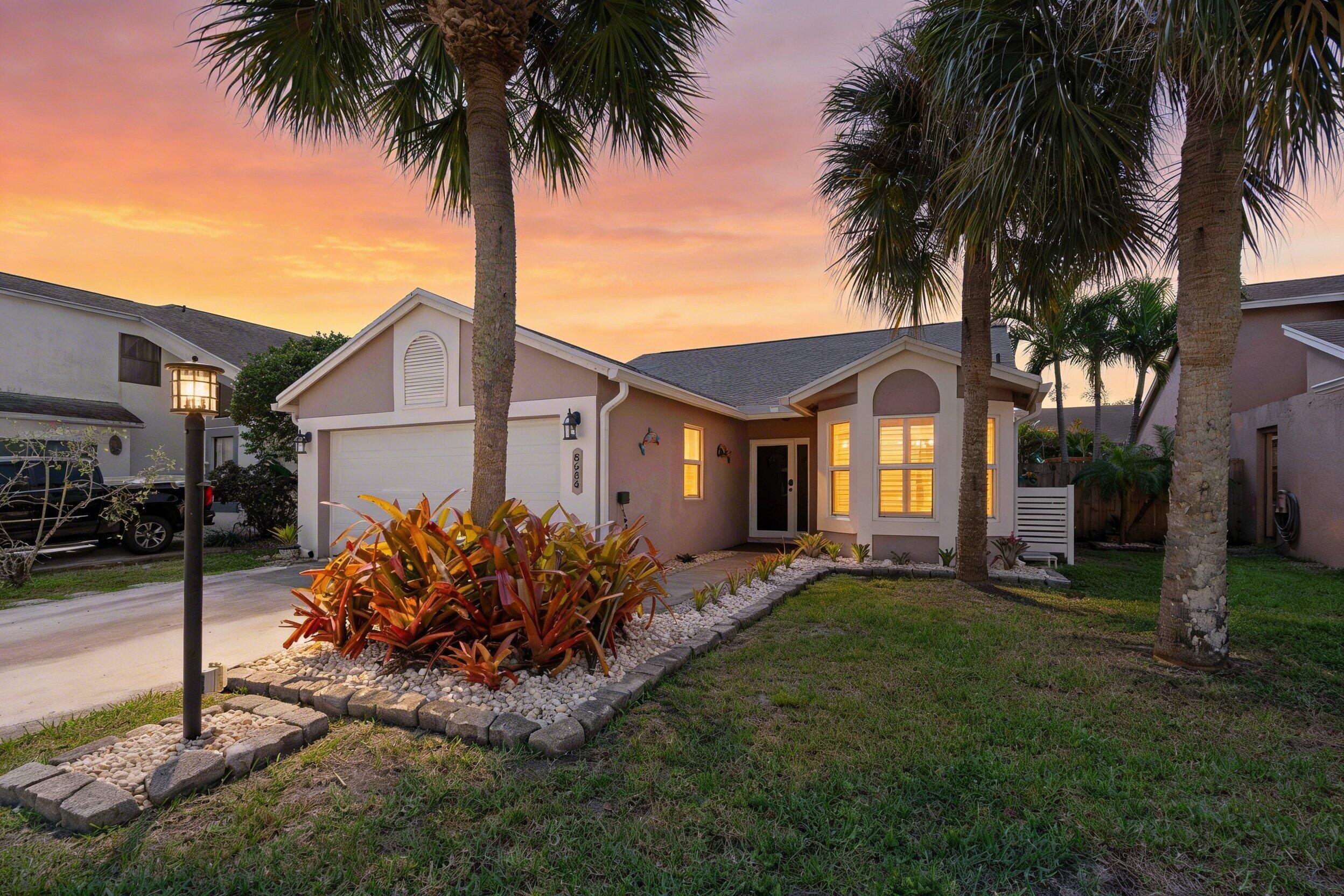 8584 Shawe Way Boca Raton, FL 33433 - Photo 1 of 43 a front view of house with yard and tree