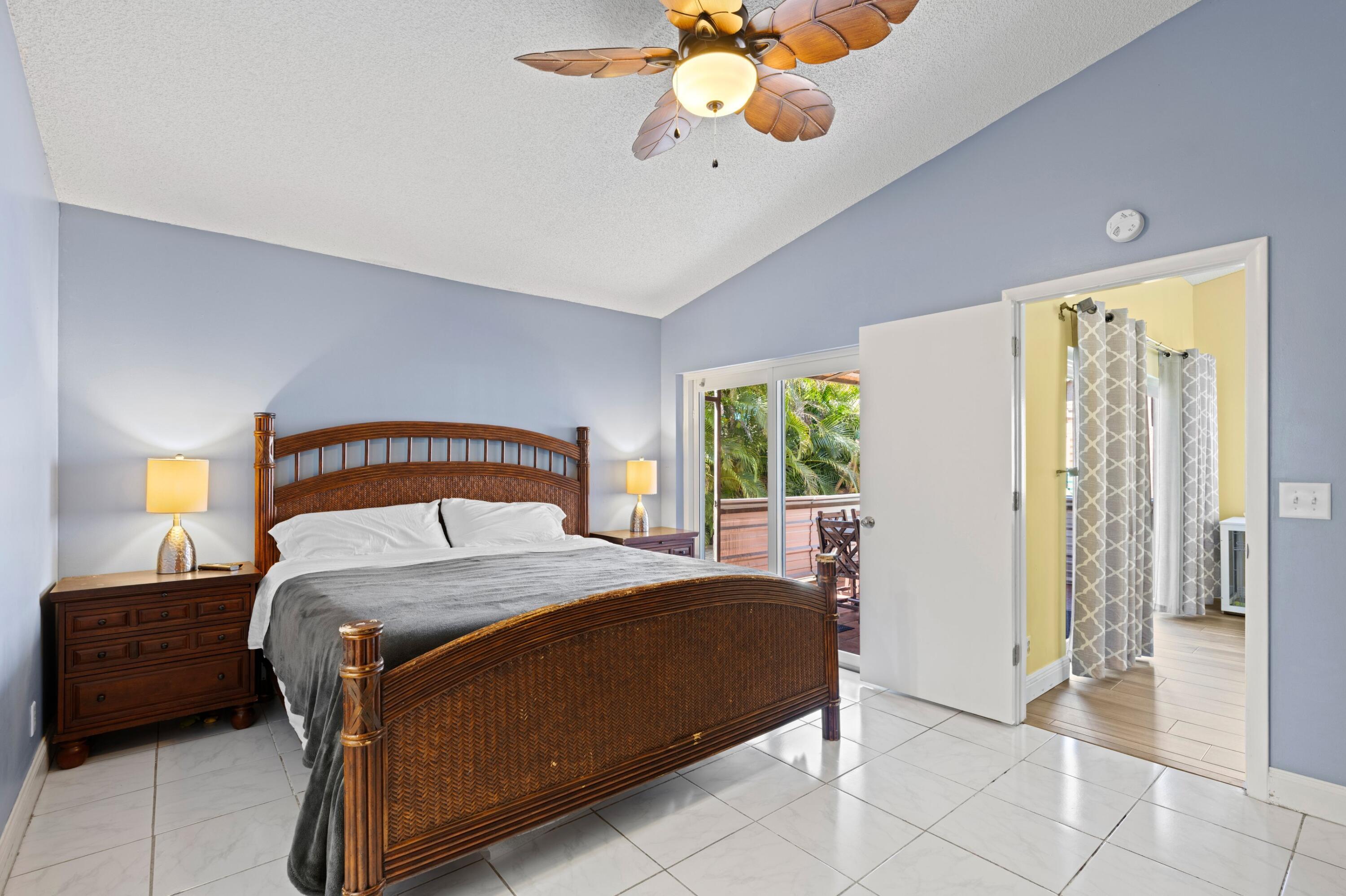 8584 Shawe Way Boca Raton, FL 33433 - Photo 12 of 43 a bedroom with a bed dresser and a window