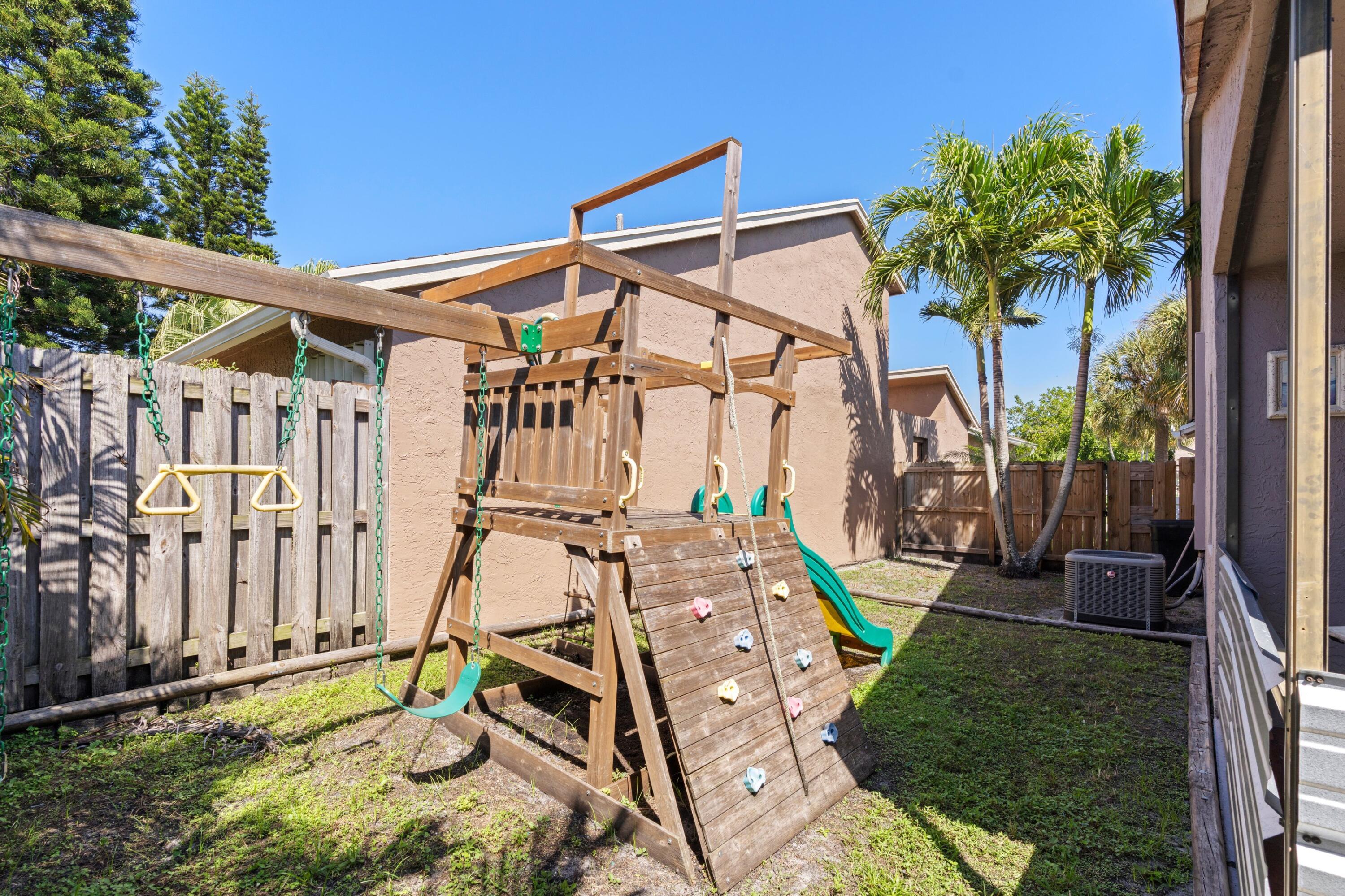 8584 Shawe Way Boca Raton, FL 33433 - Photo 18 of 43 a house with glass top table and chairs