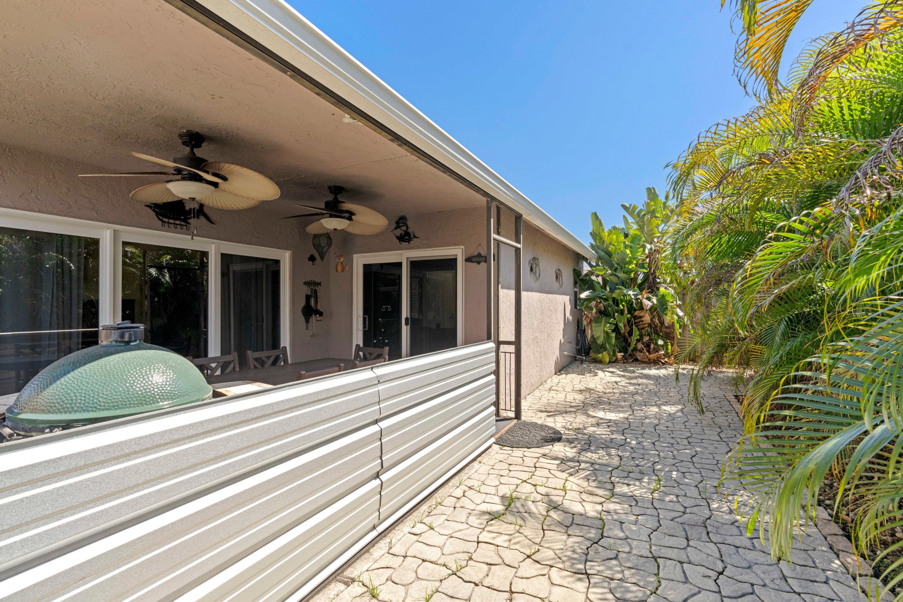 8584 Shawe Way Boca Raton, FL 33433 - Photo 20 of 43 a view of a entryway door front of house