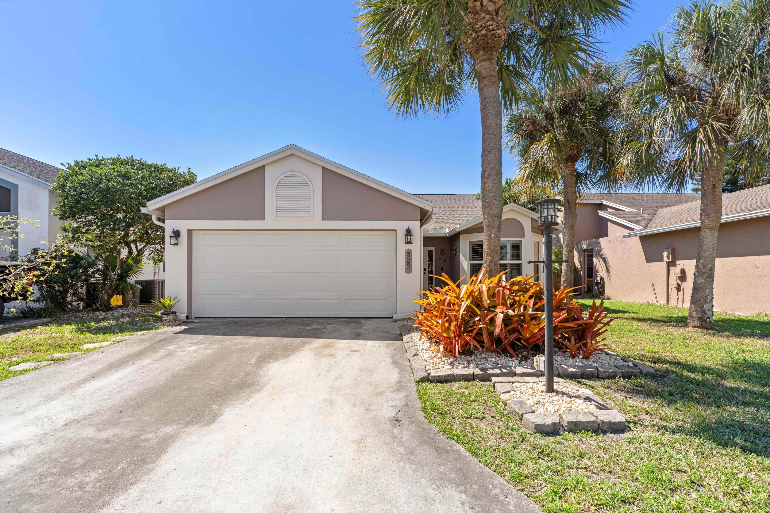 8584 Shawe Way Boca Raton, FL 33433 - Photo 22 of 43 a front view of a house with garden