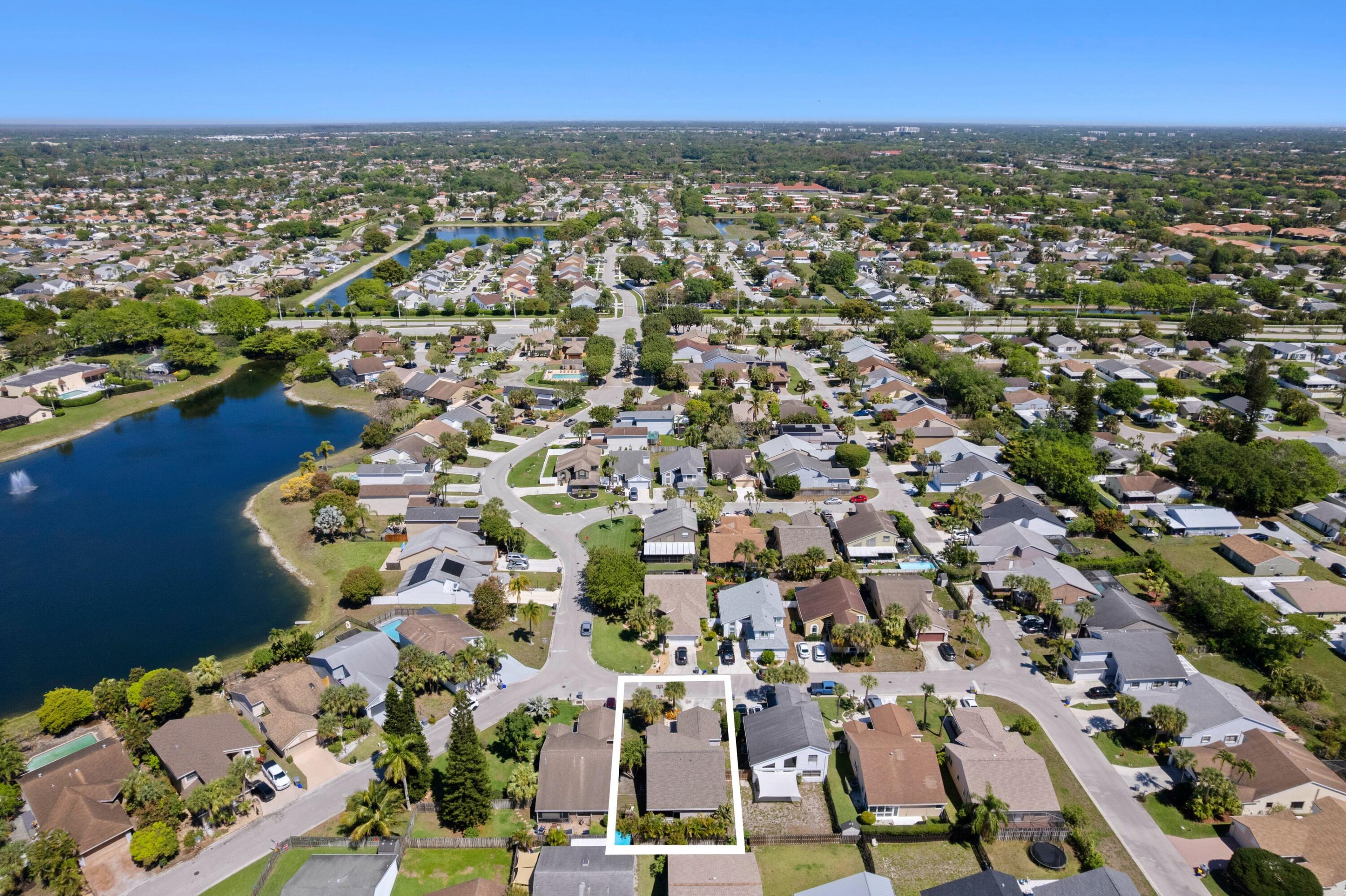 8584 Shawe Way Boca Raton, FL 33433 - Photo 25 of 43 an aerial view of a city with lots of residential buildings
