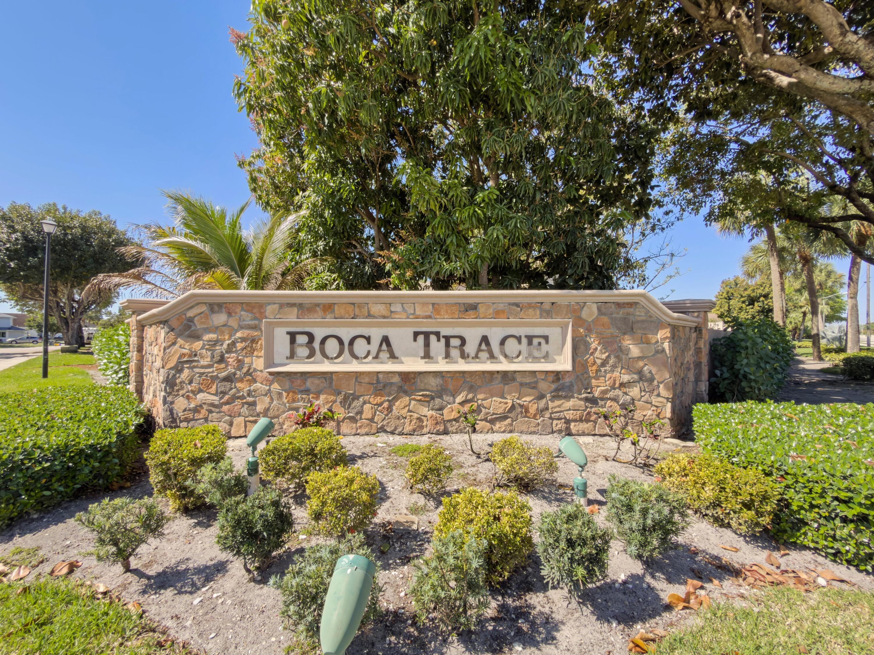 8584 Shawe Way Boca Raton, FL 33433 - Photo 30 of 43 a sign broad in front of flowers