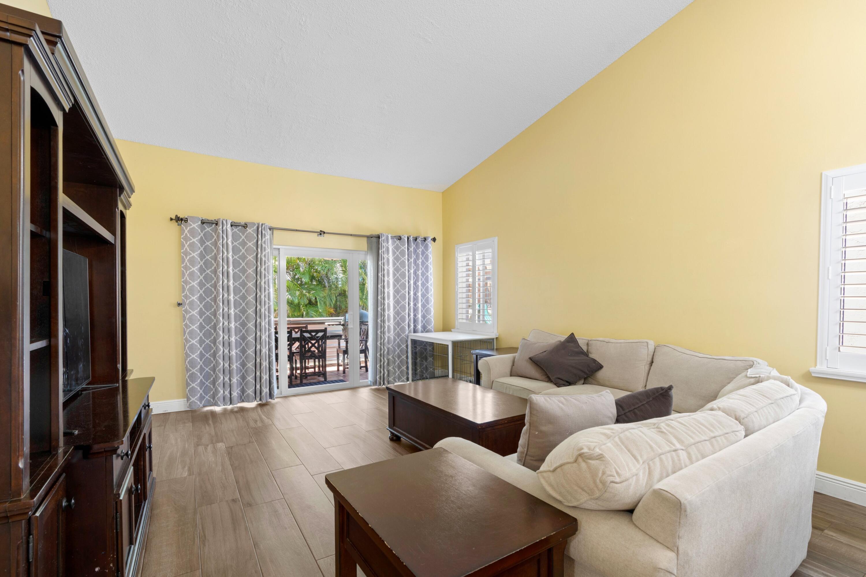 8584 Shawe Way Boca Raton, FL 33433 - Photo 5 of 43 a living room with furniture and a flat screen tv