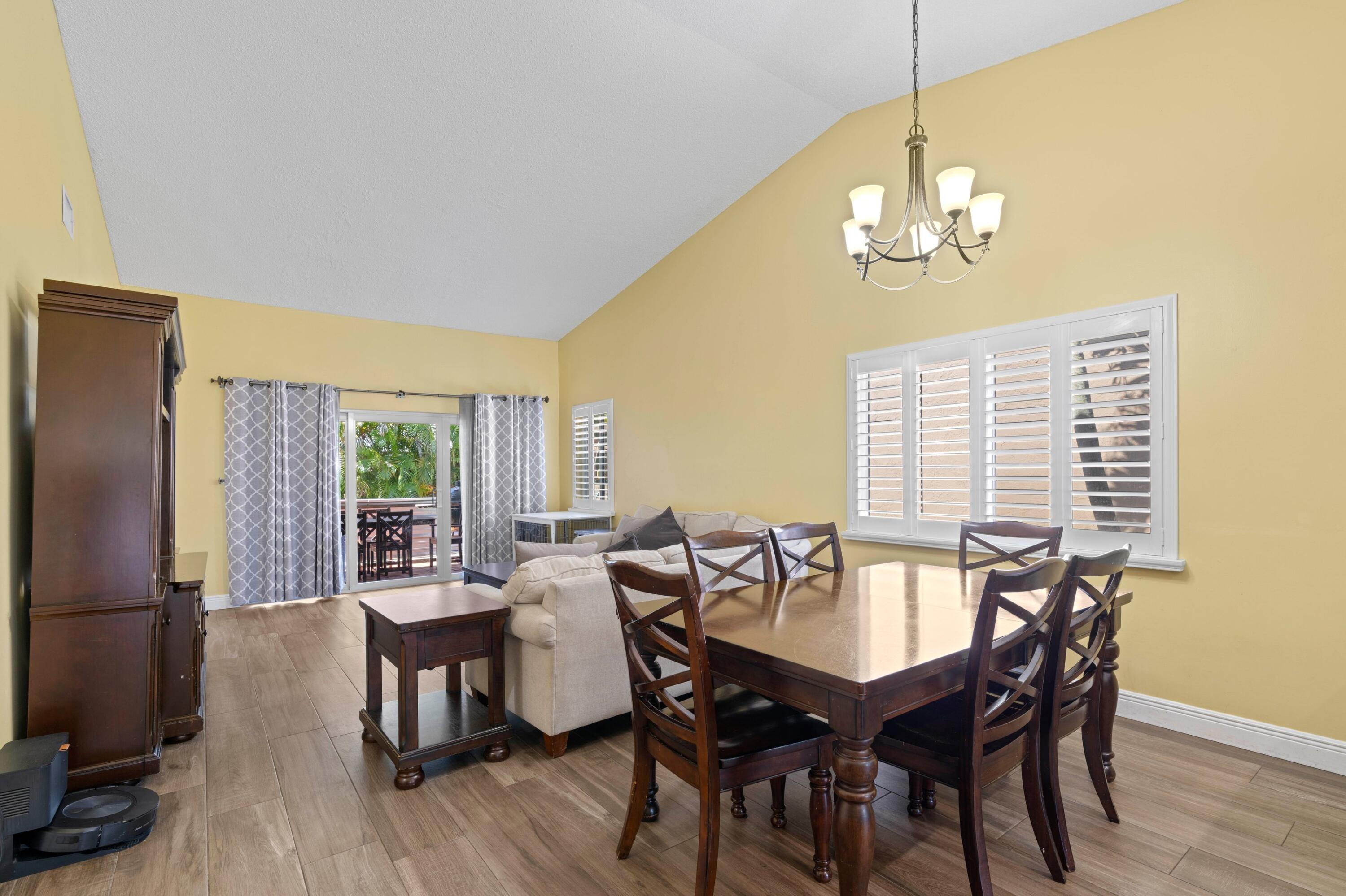 8584 Shawe Way Boca Raton, FL 33433 - Photo 6 of 43 a view of a dining room with furniture window and outside view