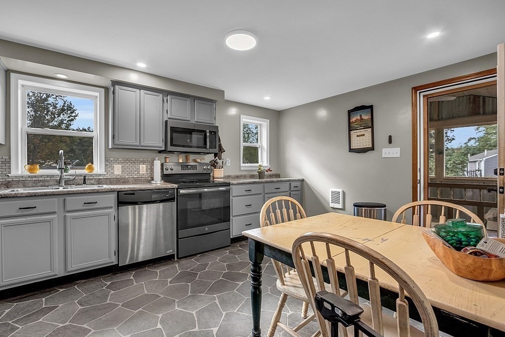 173 Memory Lane Orange, MA 01364 - Photo 11 of 28 a kitchen with sink cabinets and microwave