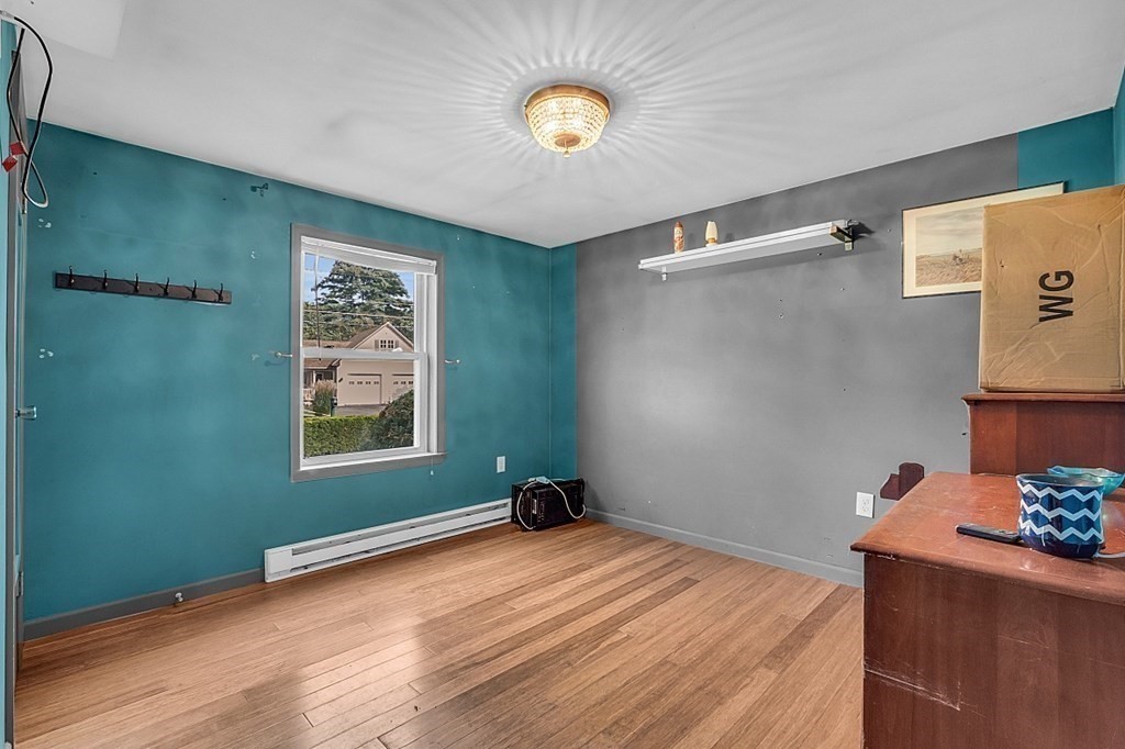 173 Memory Lane Orange, MA 01364 - Photo 18 of 28 a view of a room with wooden floor and window