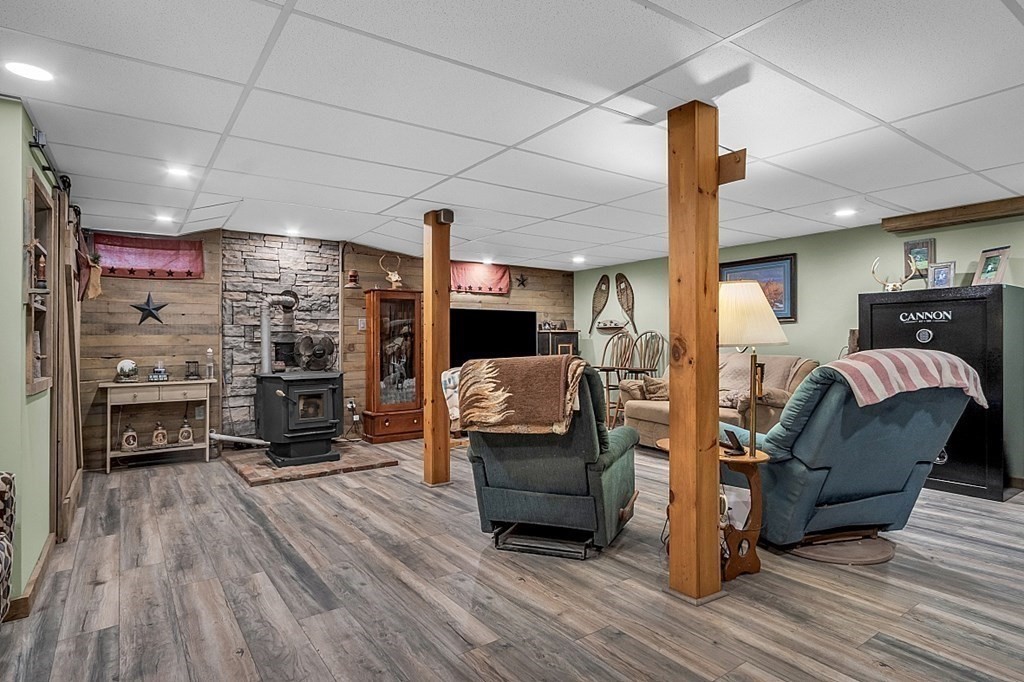 173 Memory Lane Orange, MA 01364 - Photo 23 of 28 a living room with furniture and a fireplace