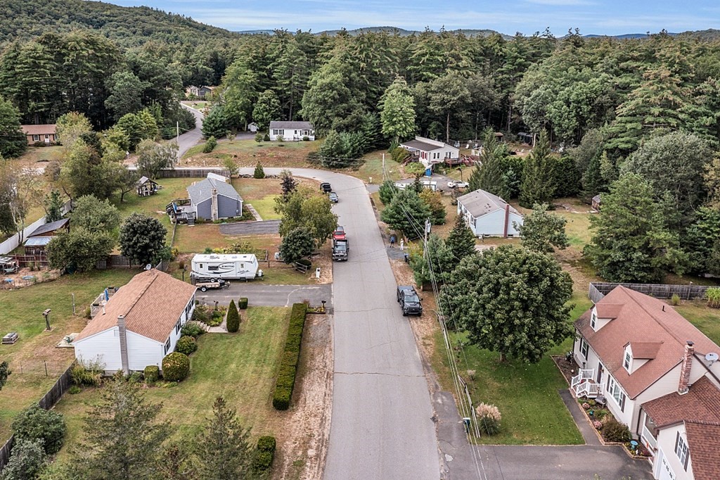 173 Memory Lane Orange, MA 01364 - Photo 26 of 28 an aerial view of a house with a yard