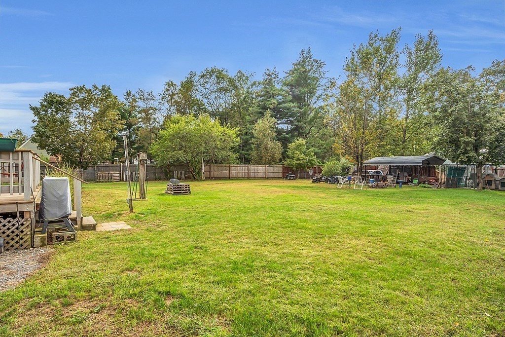 173 Memory Lane Orange, MA 01364 - Photo 4 of 28 a view of a swimming pool with a house in the background