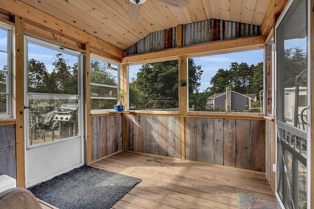 173 Memory Lane Orange, MA 01364 - Photo 9 of 28 a view of outdoor space with sliding door and wooden floor
