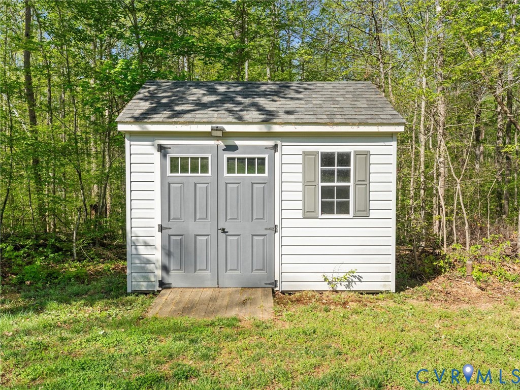 126 Reedy Creek Road Louisa, VA 23093 - Photo 63 of 68 This property features a shed with white siding, g