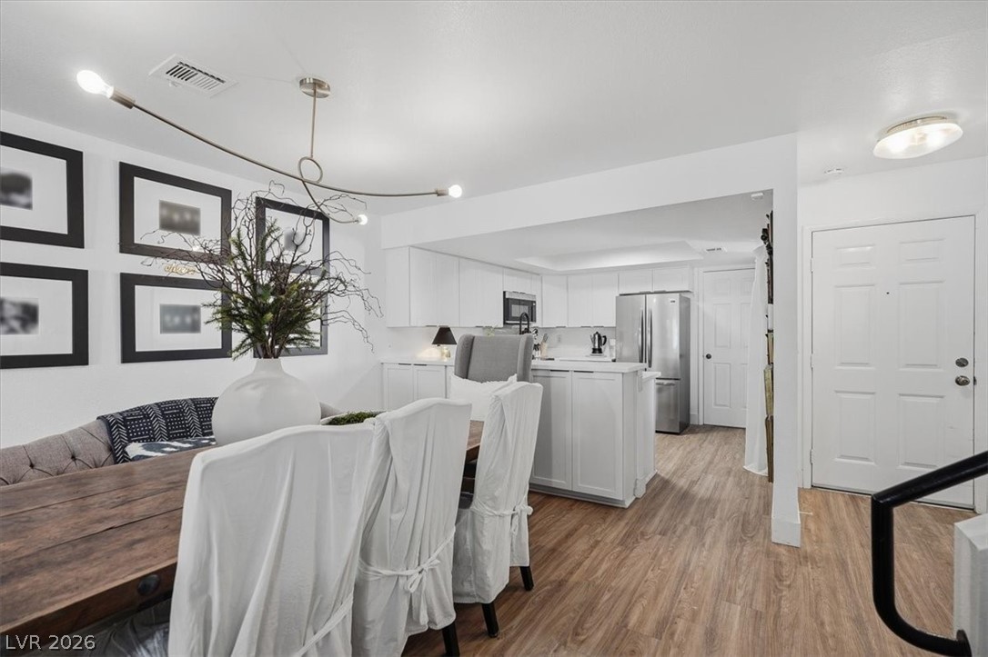 6250 West Flamingo Road, Unit 93 Las Vegas, NV 89103 - Photo 12 of 38 This open concept dining and kitchen area offers comfortable living with modern amenities.