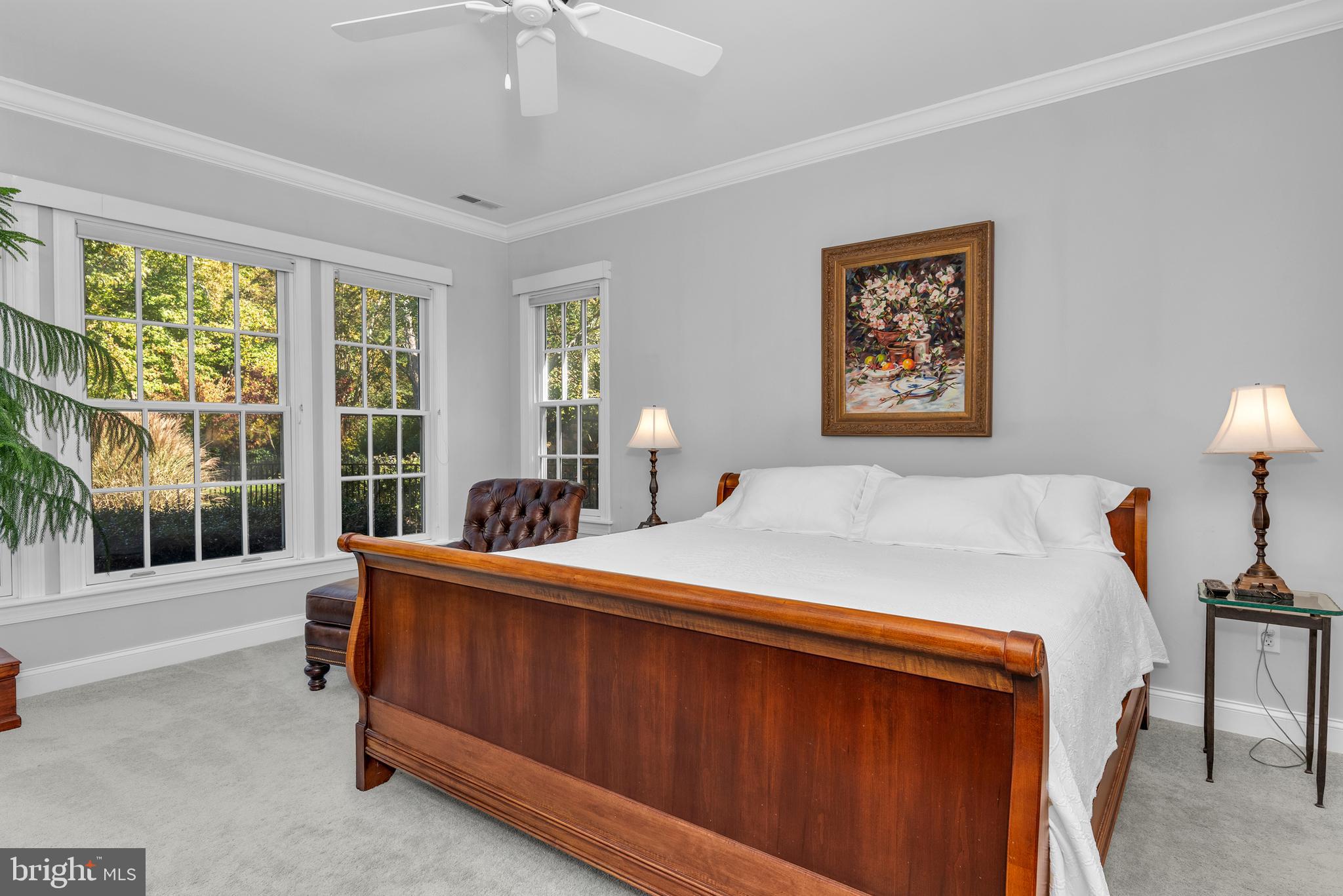 28872 Jasper Lane Easton, MD 21601 - Photo 18 of 38 a bed room with a bed and a chandelier