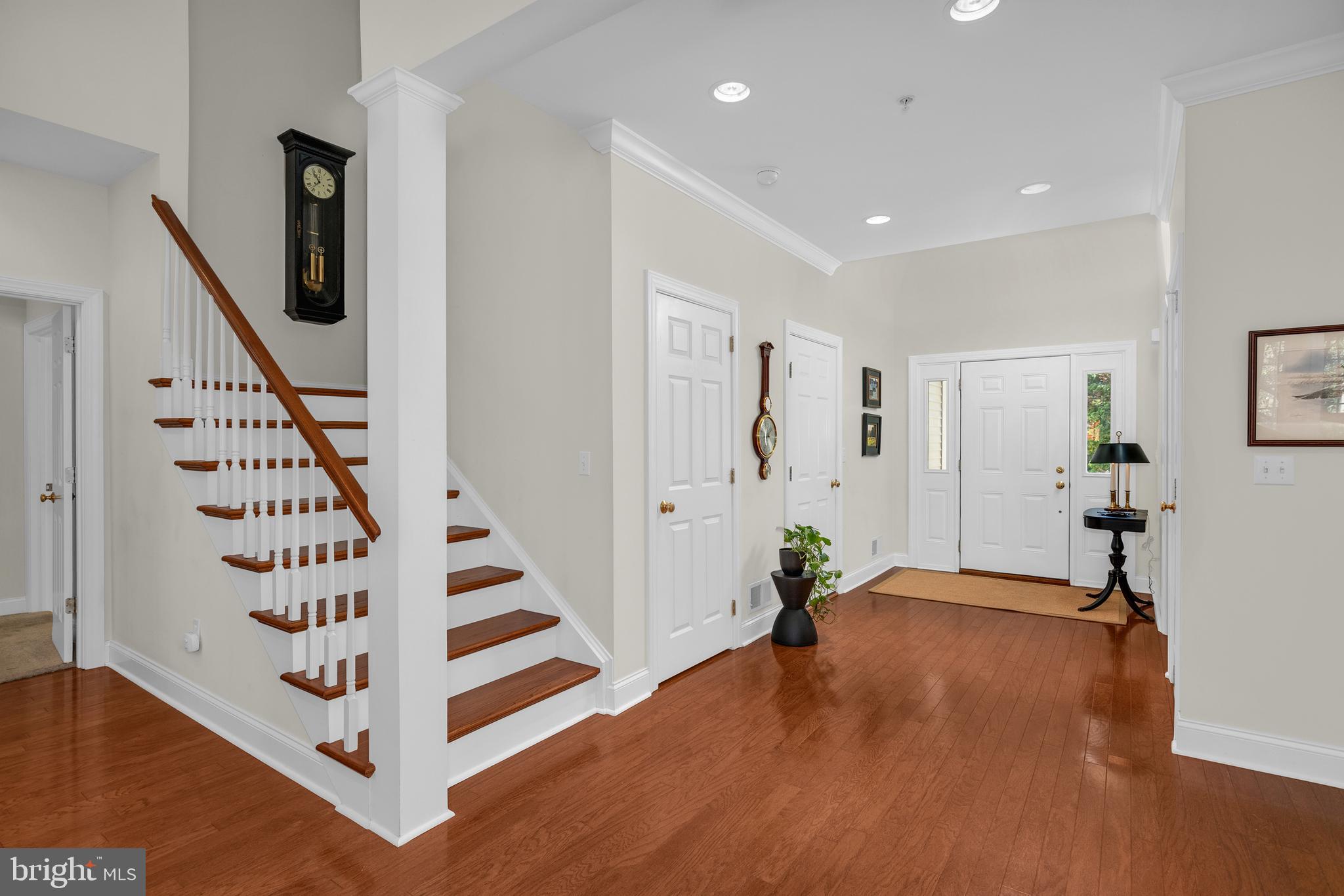 28872 Jasper Lane Easton, MD 21601 - Photo 21 of 38 a view of entryway with wooden floor and stairs
