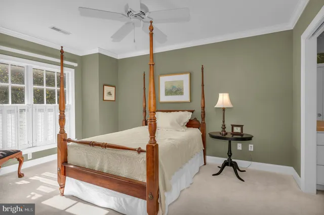 a bedroom with a bed and a table