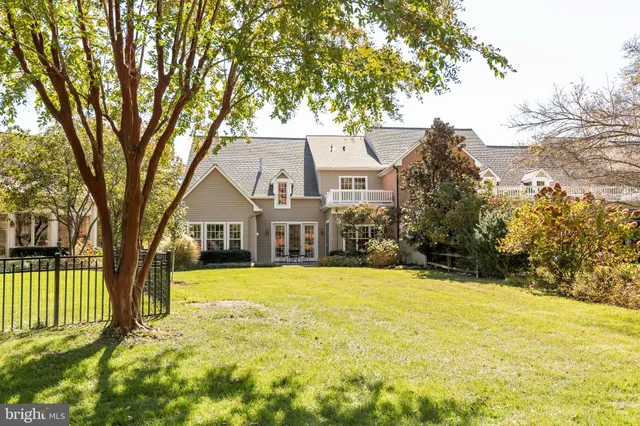 a view of house with outdoor space and garden