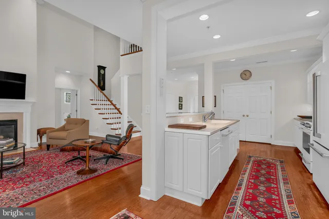 a living room with furniture and a rug