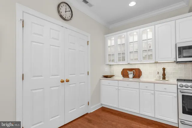 a view of cabinets with wooden floor