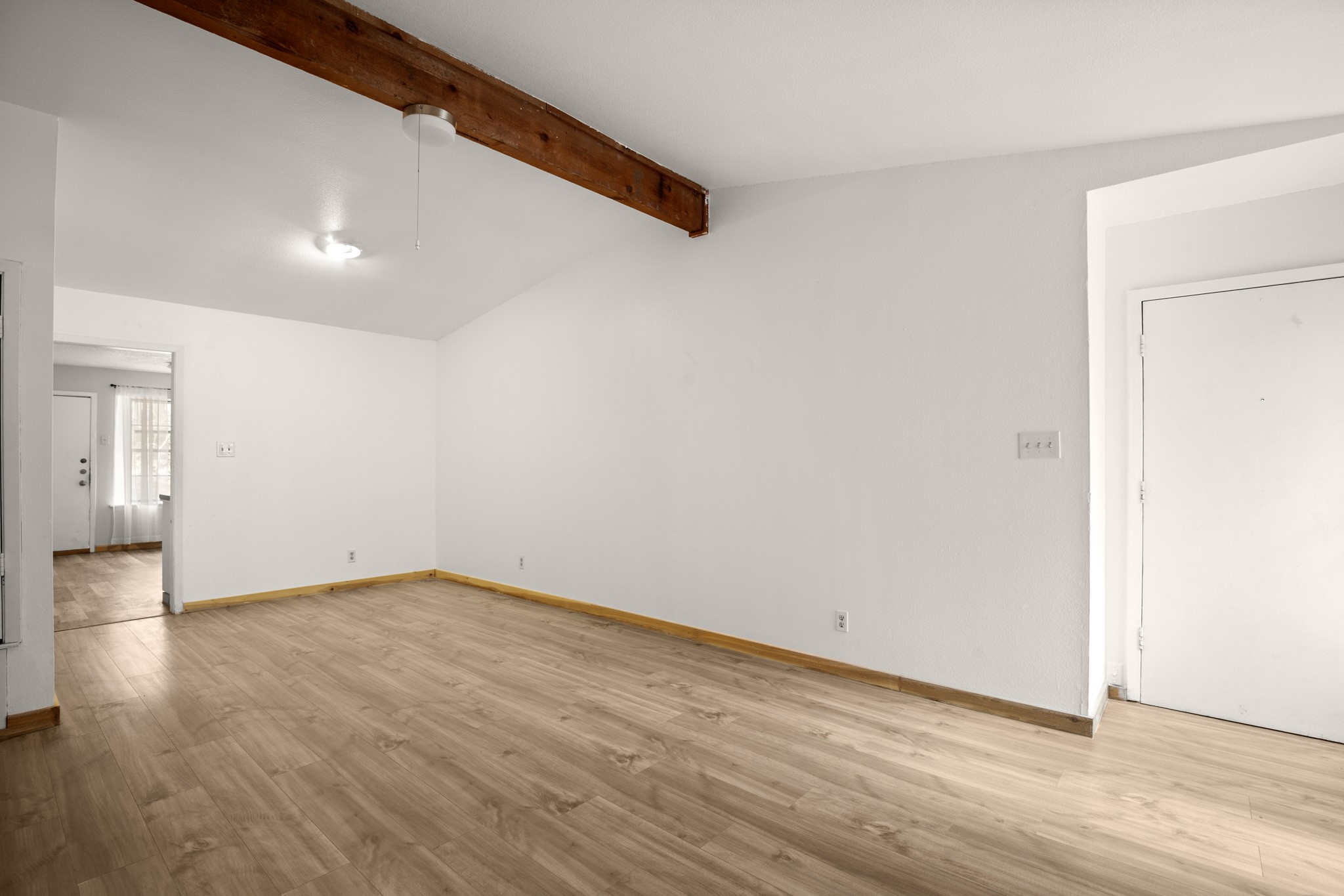 5402 Brompton Circle Austin, TX 78745 - Photo 11 of 30 Large windows allow ample natural light to fill the room.