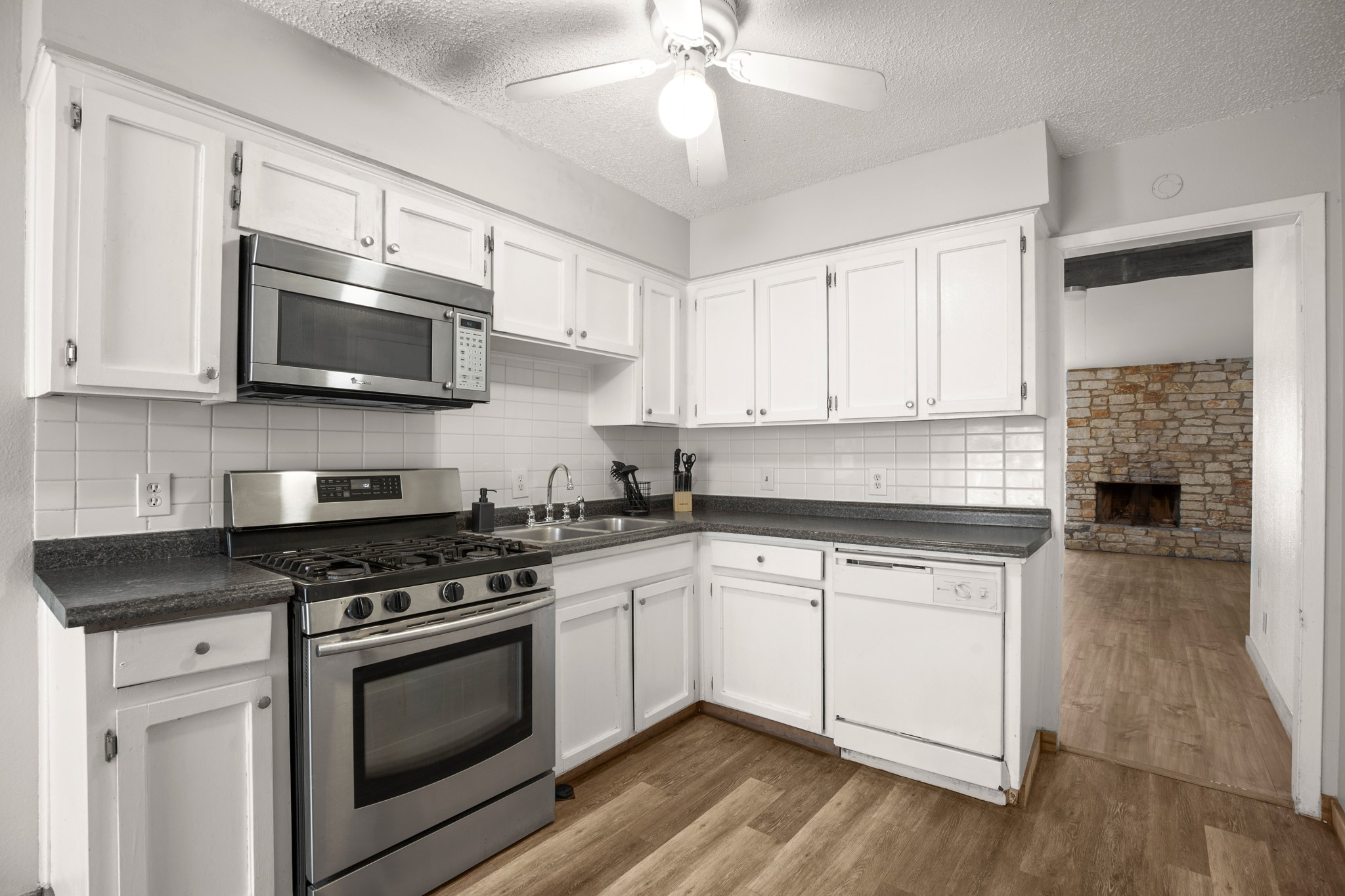 5402 Brompton Circle Austin, TX 78745 - Photo 4 of 30 The functional kitchen layouts make meal preparation efficient and comfortable.