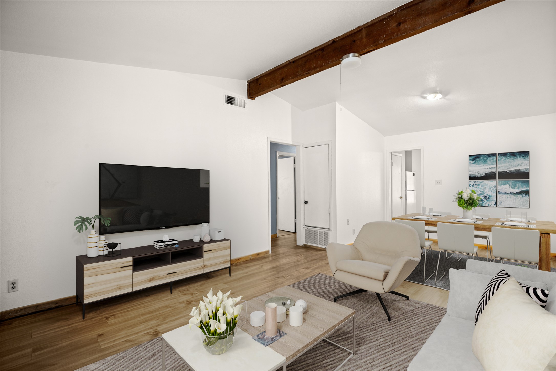 5402 Brompton Circle Austin, TX 78745 - Photo 10 of 30 Laminate flooring adds durability and a clean, modern look in Unit A. *Virtually Staged*