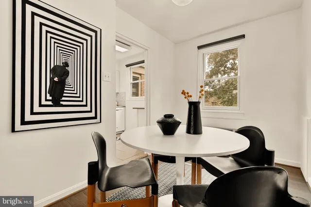 a view of a dining room with furniture and window