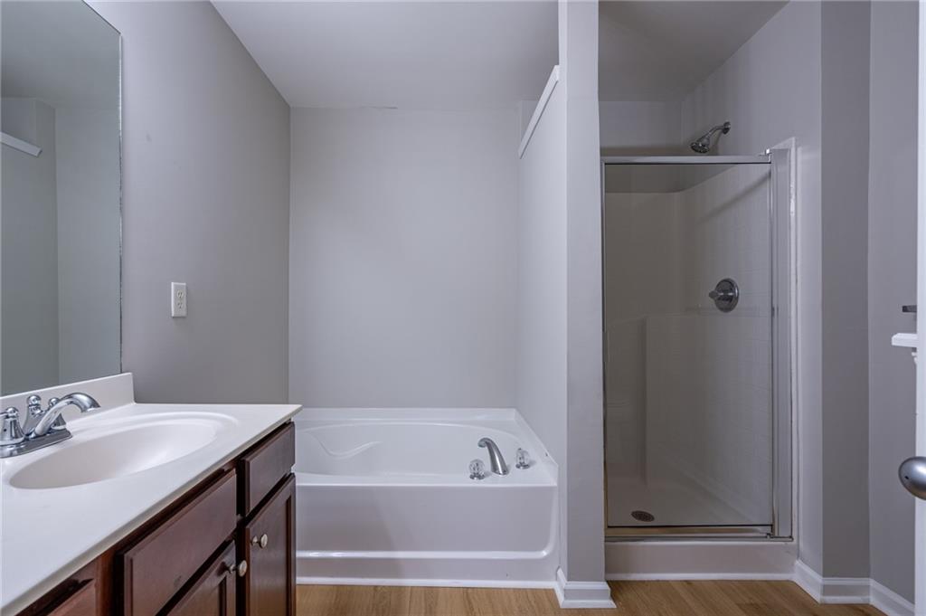 2245 Leicester Way Southeast Atlanta, GA 30316 - Photo 22 of 29 a bathroom with a tub sink vanity and a mirror