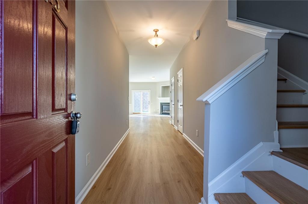 2245 Leicester Way Southeast Atlanta, GA 30316 - Photo 3 of 29 a view of a hallway with wooden floor and staircase