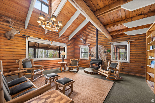 4725 Pine Ridge Road Evanston, UT 82930 - Photo 11 of 82 Vaulted wood-plank ceiling with exposed log beam
