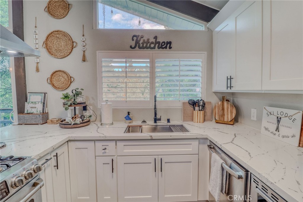 26669 Highway 189 Twin Peaks, CA 92391 - Photo 13 of 68 a kitchen with sink and a stove