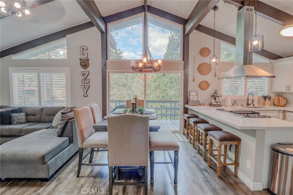 26669 Highway 189 Twin Peaks, CA 92391 - Photo 16 of 68 a living room with furniture a large window and a table